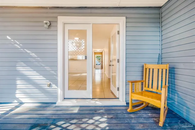 a view of outdoor space with wooden floor and stairs