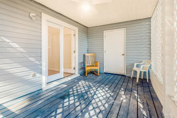 a view of a yard with wooden fence