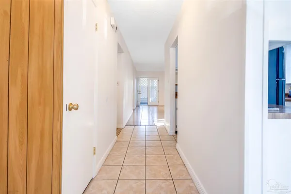 a view of a hallway with a white walls