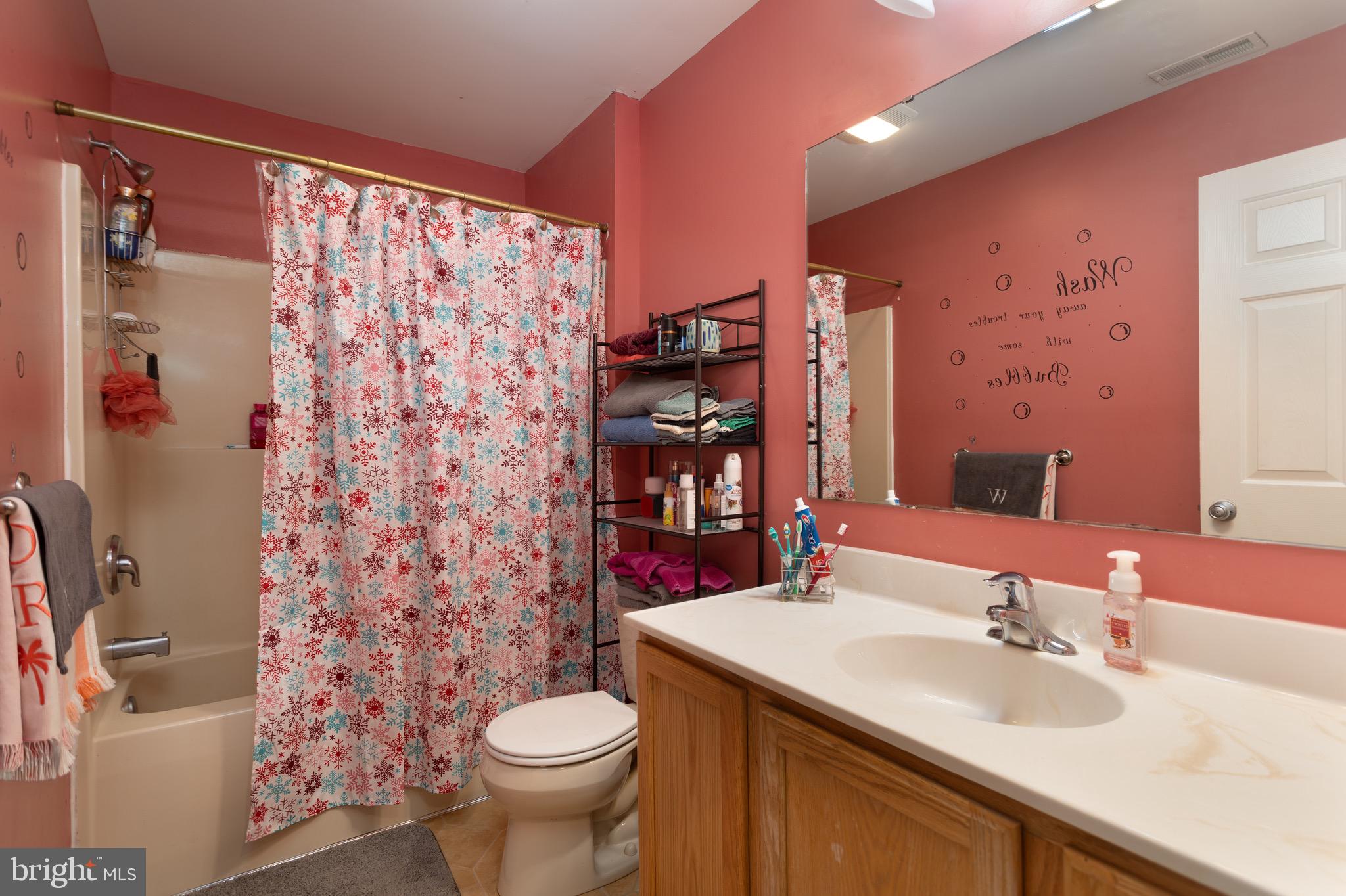 1303 Colonial Avenue Cambridge, MD 21613 - Photo 7 of 12 a bathroom with a sink toilet and shower