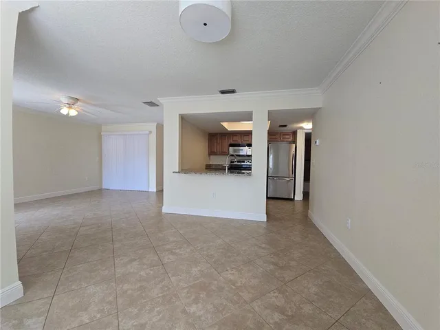 a view of a livingroom with a kitchen