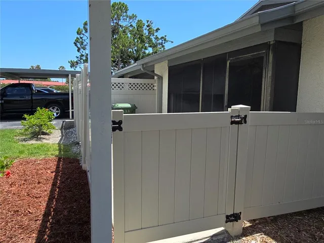a view of a house with a potted plant