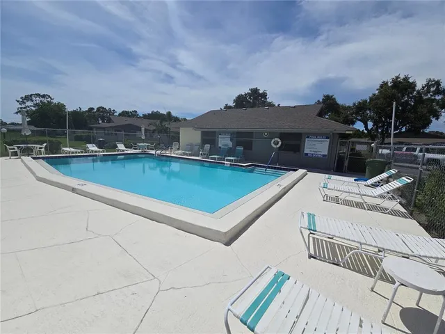 a view of a terrace with a table and chairs