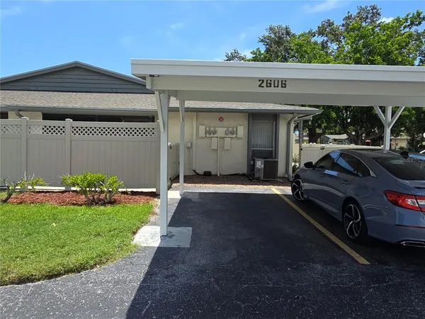 a view of a car park in front of house