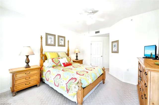 a bed room with a bed and a night stand