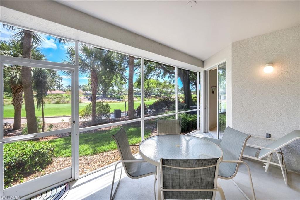 2190 Arielle Drive, Unit 903 Naples, FL 34109 - Photo 19 of 26 a view of a dining room with furniture window and outside view