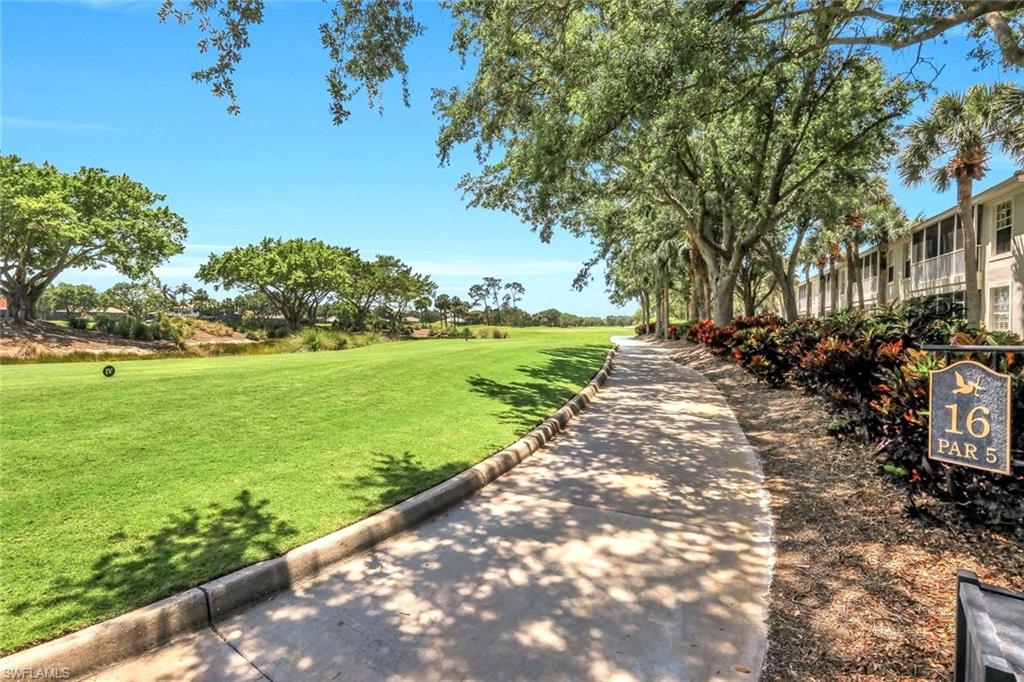 2190 Arielle Drive, Unit 903 Naples, FL 34109 - Photo 21 of 26 a view of a yard with an trees
