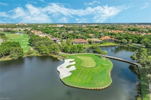 an aerial view of a house with a lake view