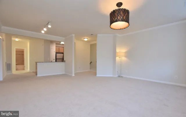 a kitchen with granite countertop a sink and cabinets