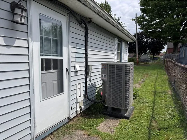 a view of a house with a yard and sitting area