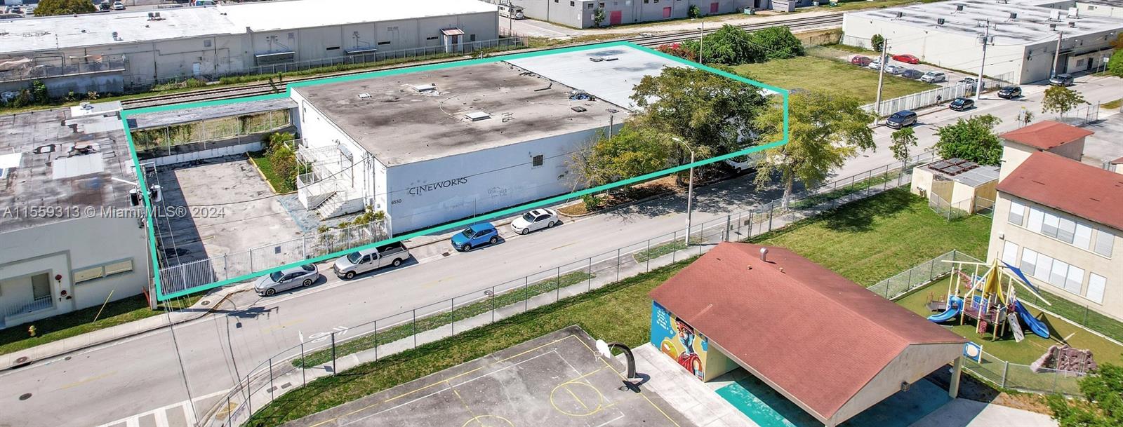 an aerial view of a house with a garden and plants