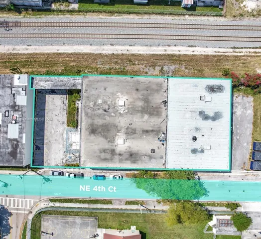 a view of swimming pool with a yard and plants