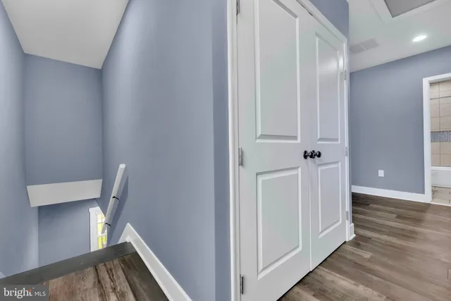 a view of front door with wooden floor