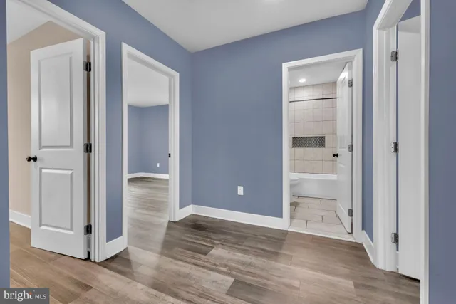 wooden floor and closet area in a room