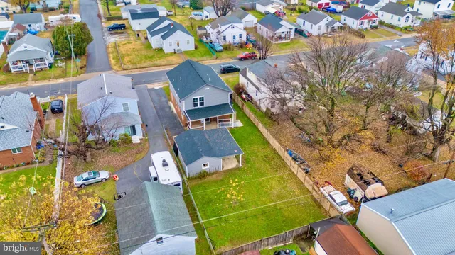 an aerial view of a house with a swimming pool
