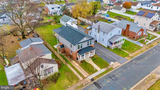 an aerial view of a house with a swimming pool