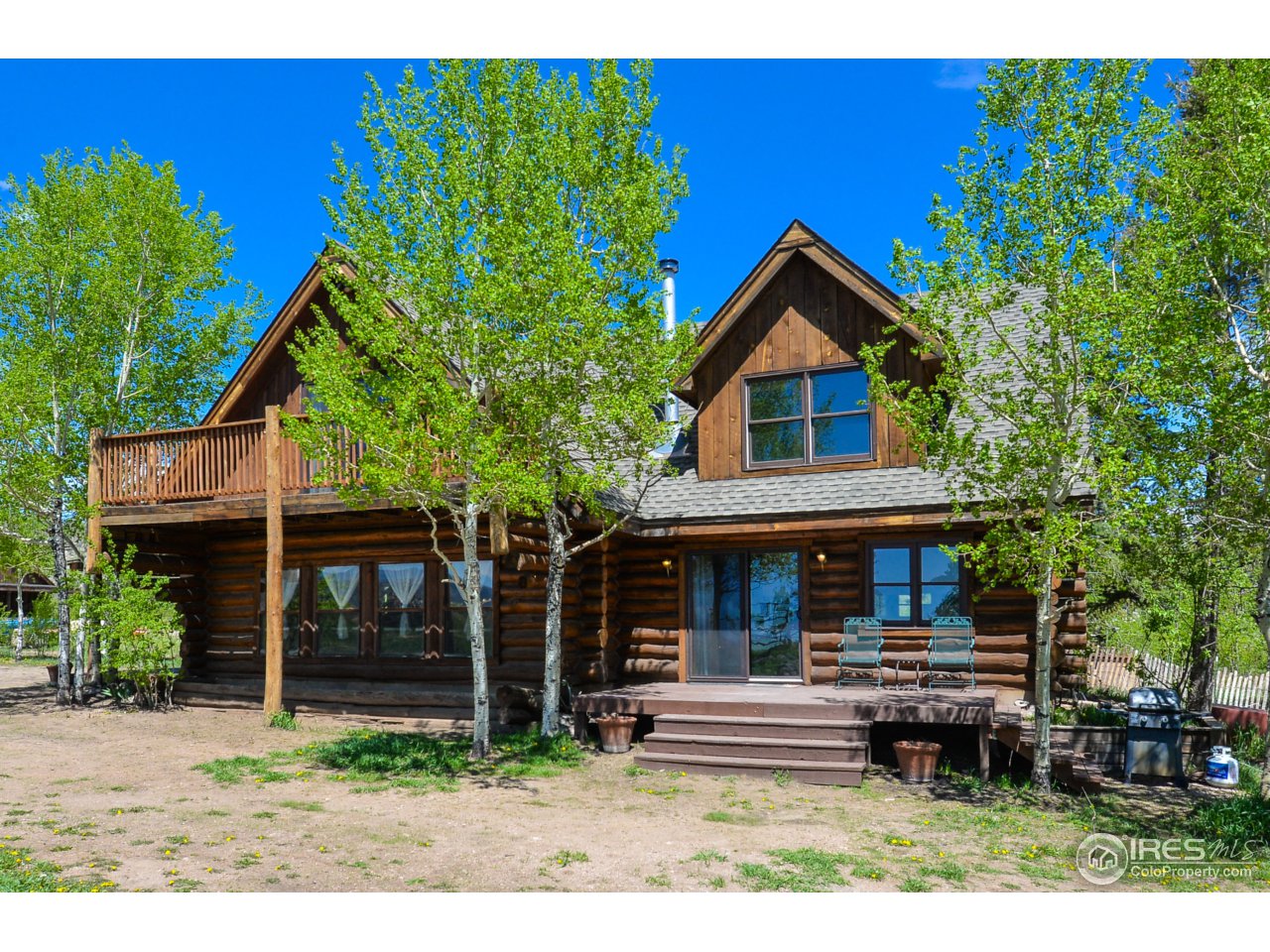 3521 Davis Ranch Road Bellvue, CO 80512 - Photo 3 of 40 a front view of a house with a yard