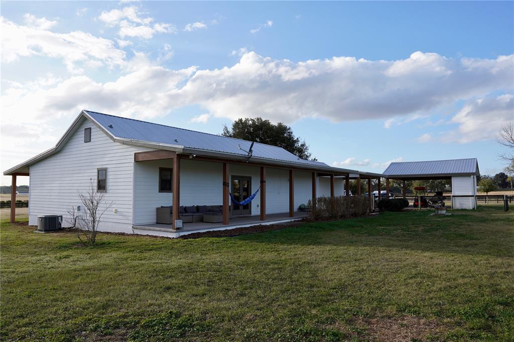 12895 Northwest Gainesville Road Reddick, FL 32686 - Photo 15 of 51 a view of a house with a yard