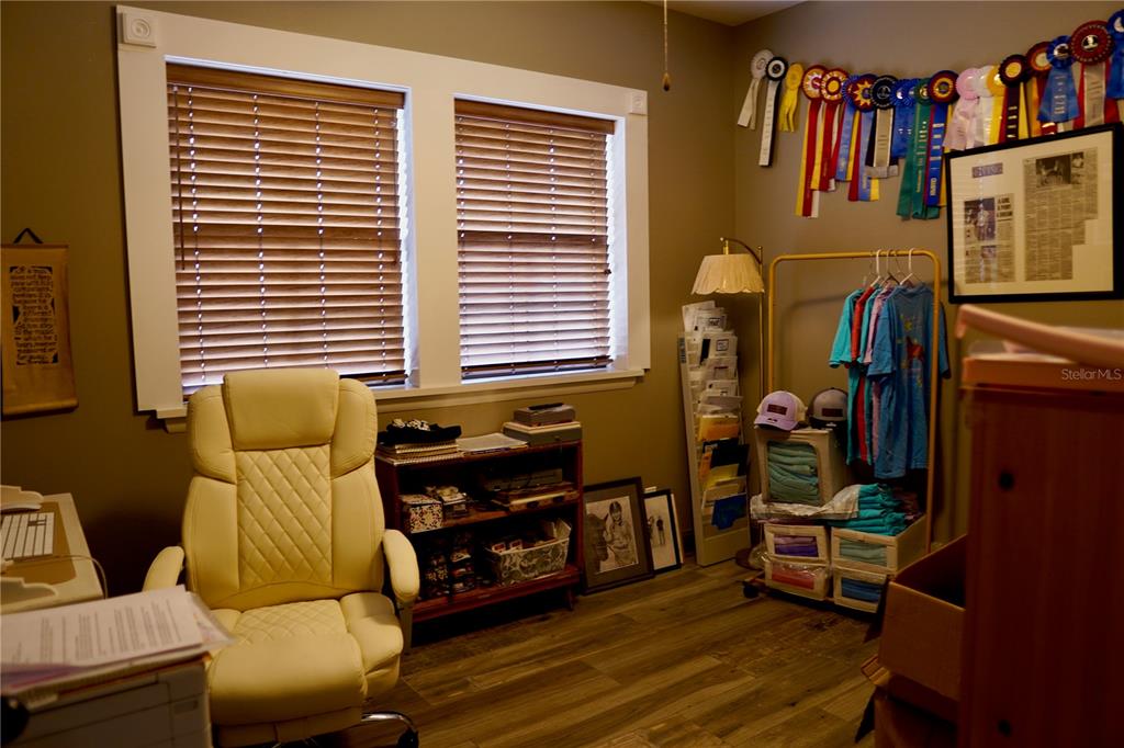 12895 Northwest Gainesville Road Reddick, FL 32686 - Photo 16 of 51 a dining room with furniture and wooden floor