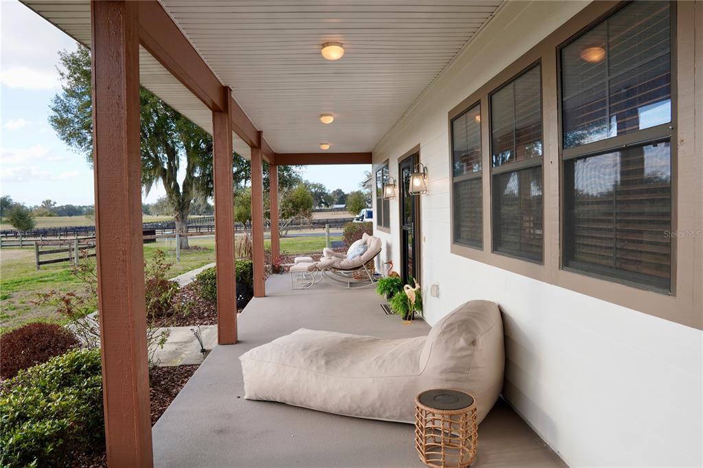 12895 Northwest Gainesville Road Reddick, FL 32686 - Photo 19 of 51 a outdoor living space with furniture and garden view
