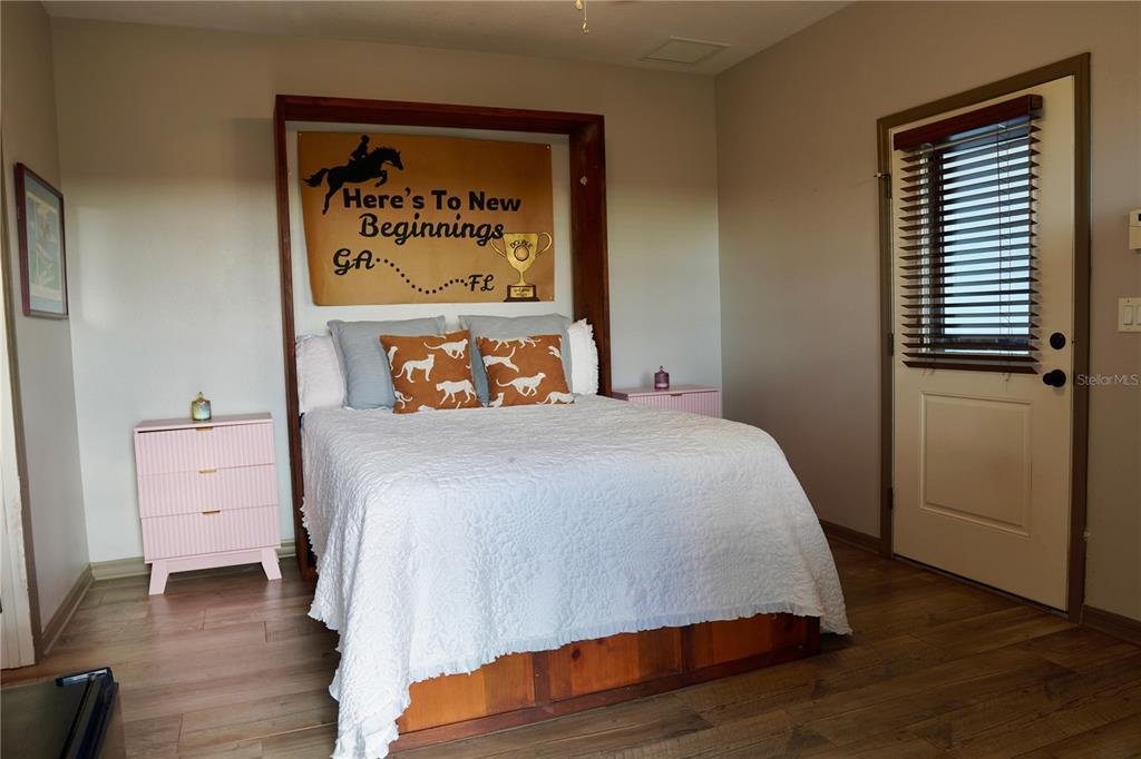 12895 Northwest Gainesville Road Reddick, FL 32686 - Photo 21 of 51 a bedroom with a bed and a dresser