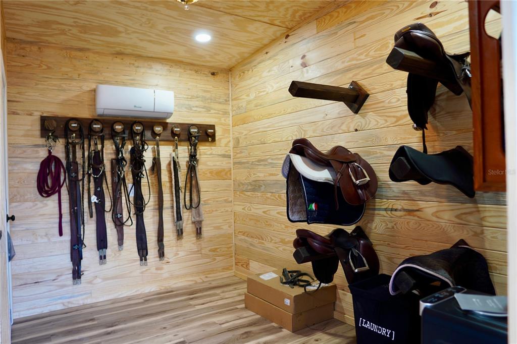 12895 Northwest Gainesville Road Reddick, FL 32686 - Photo 36 of 51 a view of walk in closet with clothes and shoes