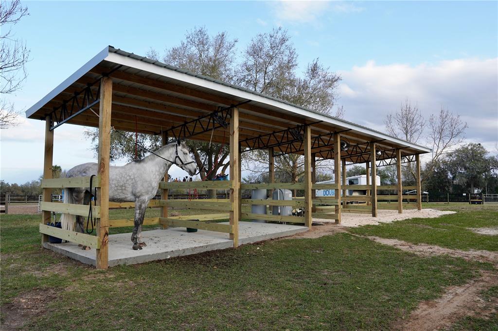 12895 Northwest Gainesville Road Reddick, FL 32686 - Photo 38 of 51 a backyard of a house with barbeque oven table and chairs