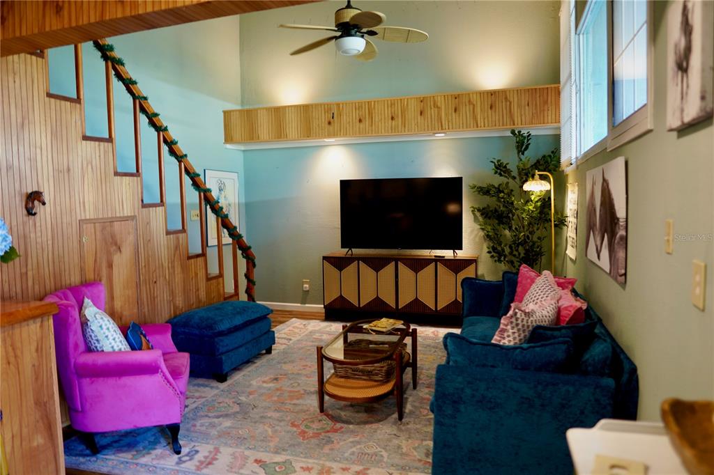 12895 Northwest Gainesville Road Reddick, FL 32686 - Photo 40 of 51 a living room with furniture and a flat screen tv