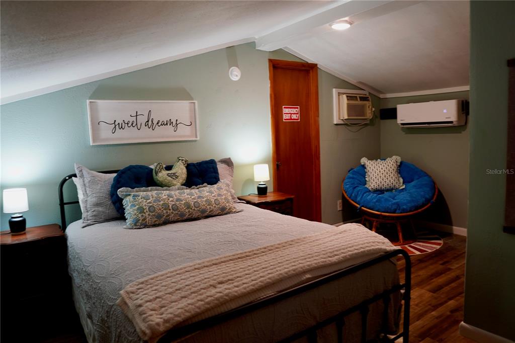 12895 Northwest Gainesville Road Reddick, FL 32686 - Photo 43 of 51 a bedroom with a bed and wall painting