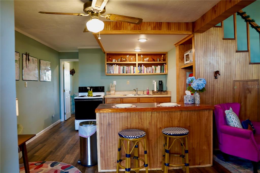12895 Northwest Gainesville Road Reddick, FL 32686 - Photo 44 of 51 a bedroom with a bed and a chandelier