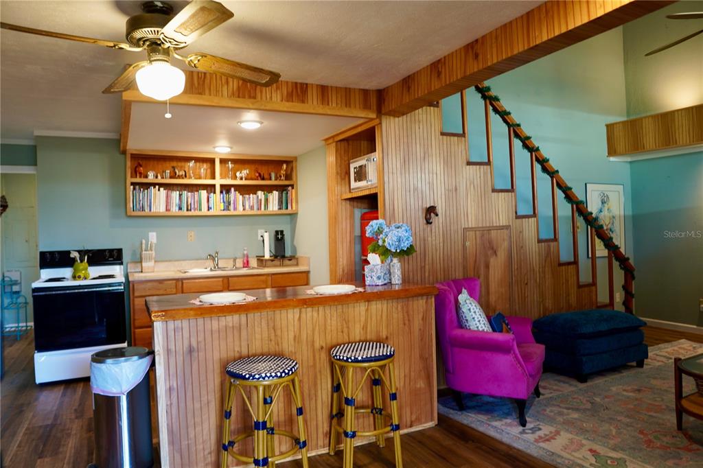 12895 Northwest Gainesville Road Reddick, FL 32686 - Photo 47 of 51 a view of a dining room with furniture and wooden floor