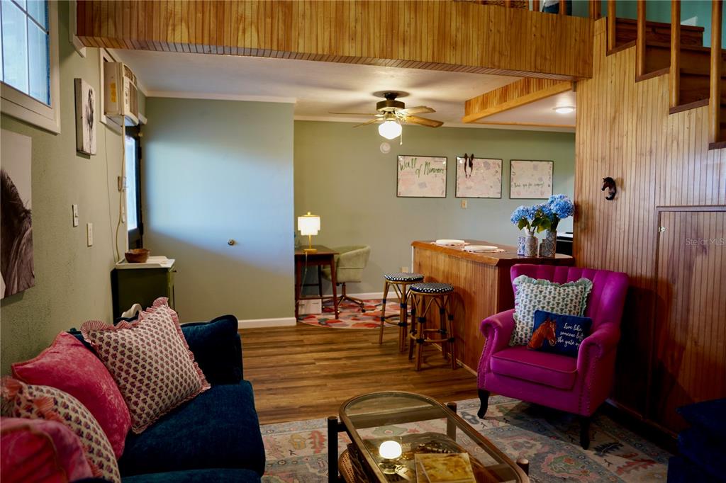 12895 Northwest Gainesville Road Reddick, FL 32686 - Photo 48 of 51 a living room with furniture and a chandelier