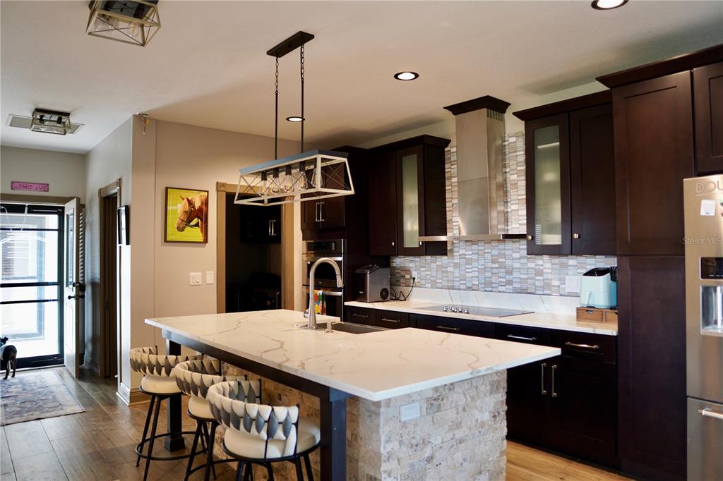 12895 Northwest Gainesville Road Reddick, FL 32686 - Photo 9 of 51 a kitchen with a table and chairs in it