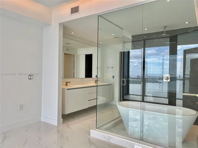 a outdoor space with the couches and dining table with the garden view