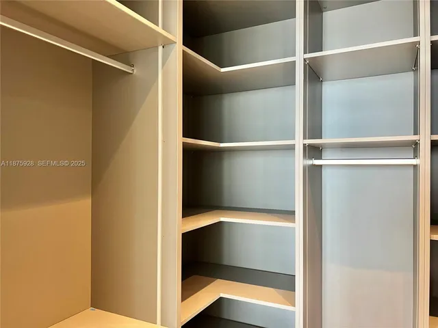 a room with gym equipment and floor to ceiling window