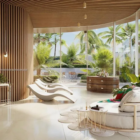 a lobby with furniture and flowers