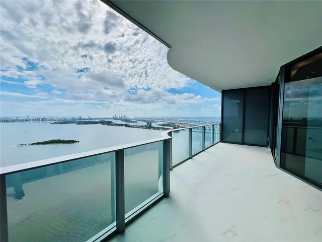 a kitchen with stainless steel appliances a sink stove and cabinets