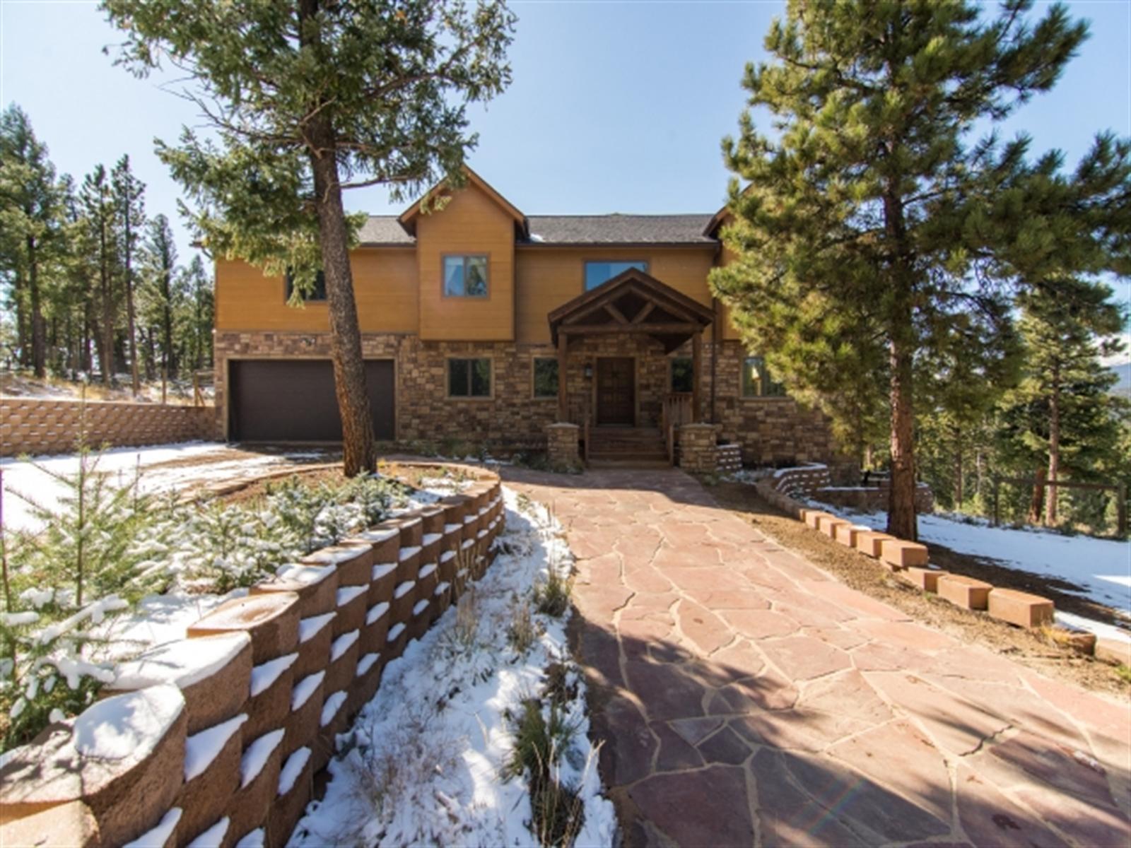 1229 Tapadero Road Bailey, CO 80421 - Photo 1 of 1 a view of a yard covered in snow