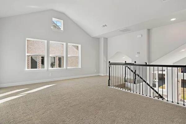 a view of white house with large windows