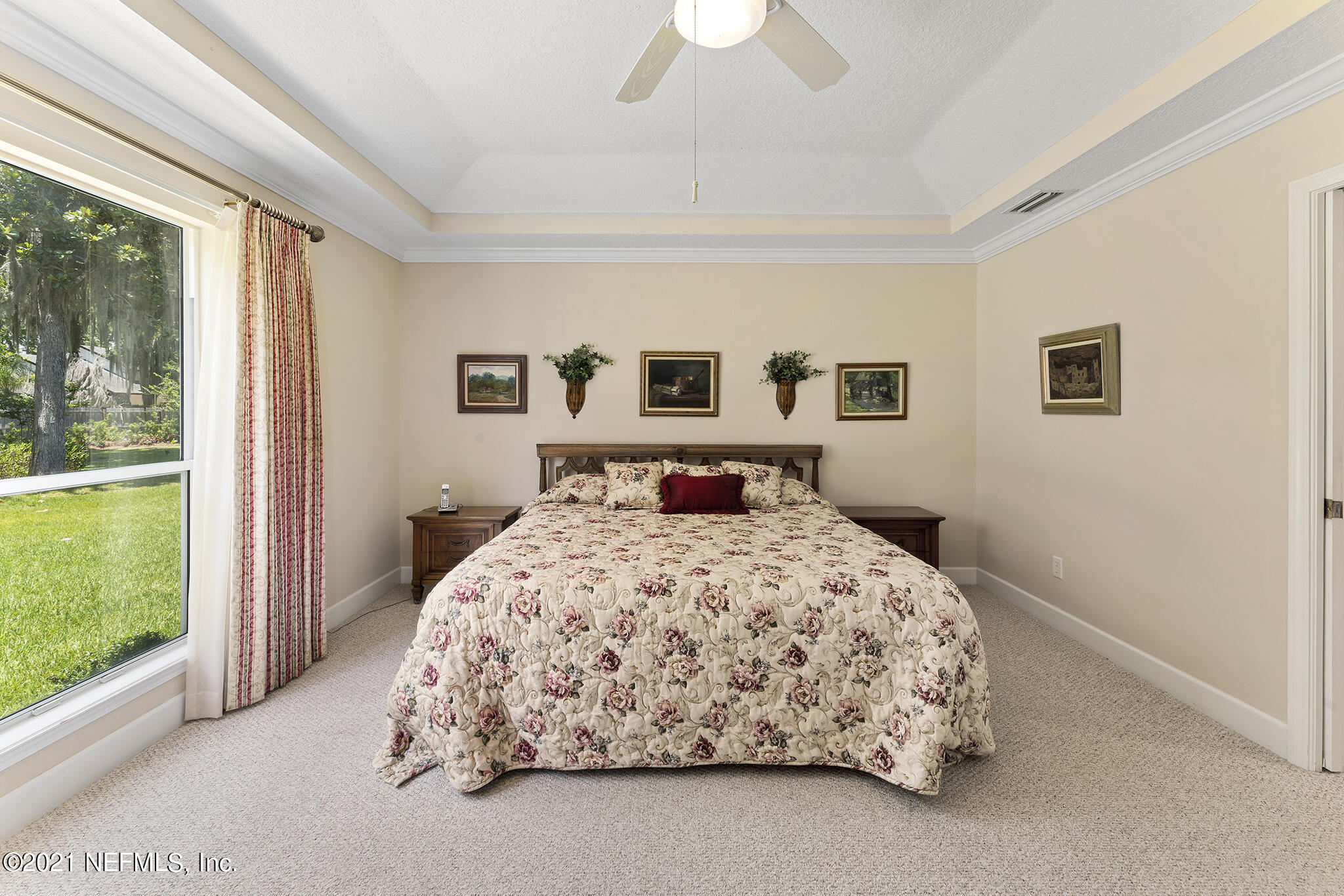 2284 Emilys Way Fleming Island, FL 32003 - Photo 14 of 52 a bedroom with a large bed and a window