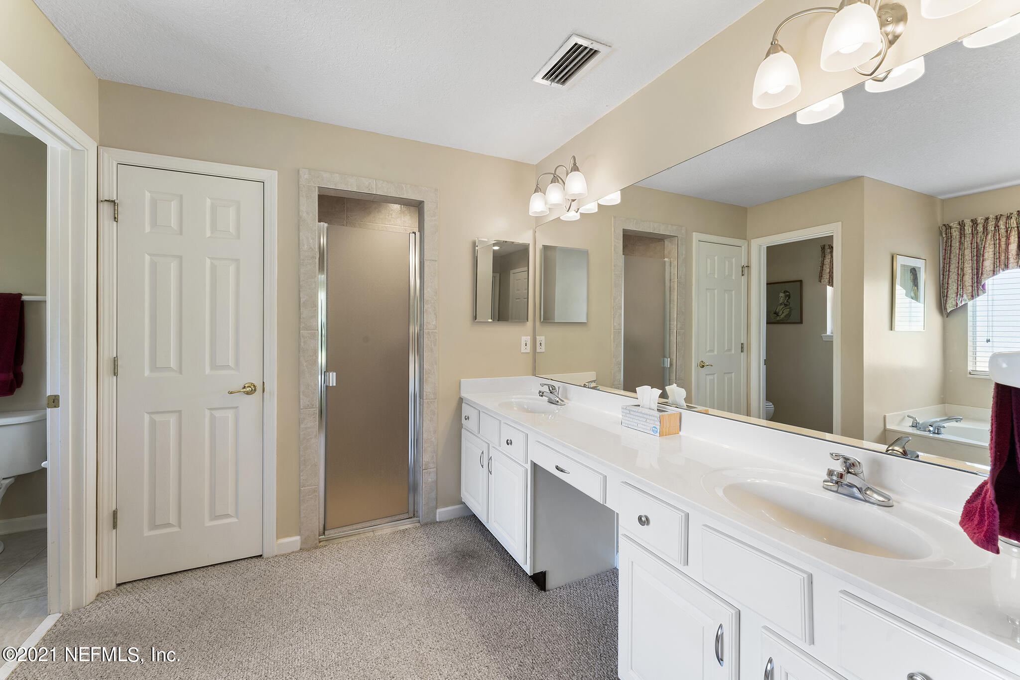 2284 Emilys Way Fleming Island, FL 32003 - Photo 17 of 52 a bathroom with a double vanity sink and a mirror
