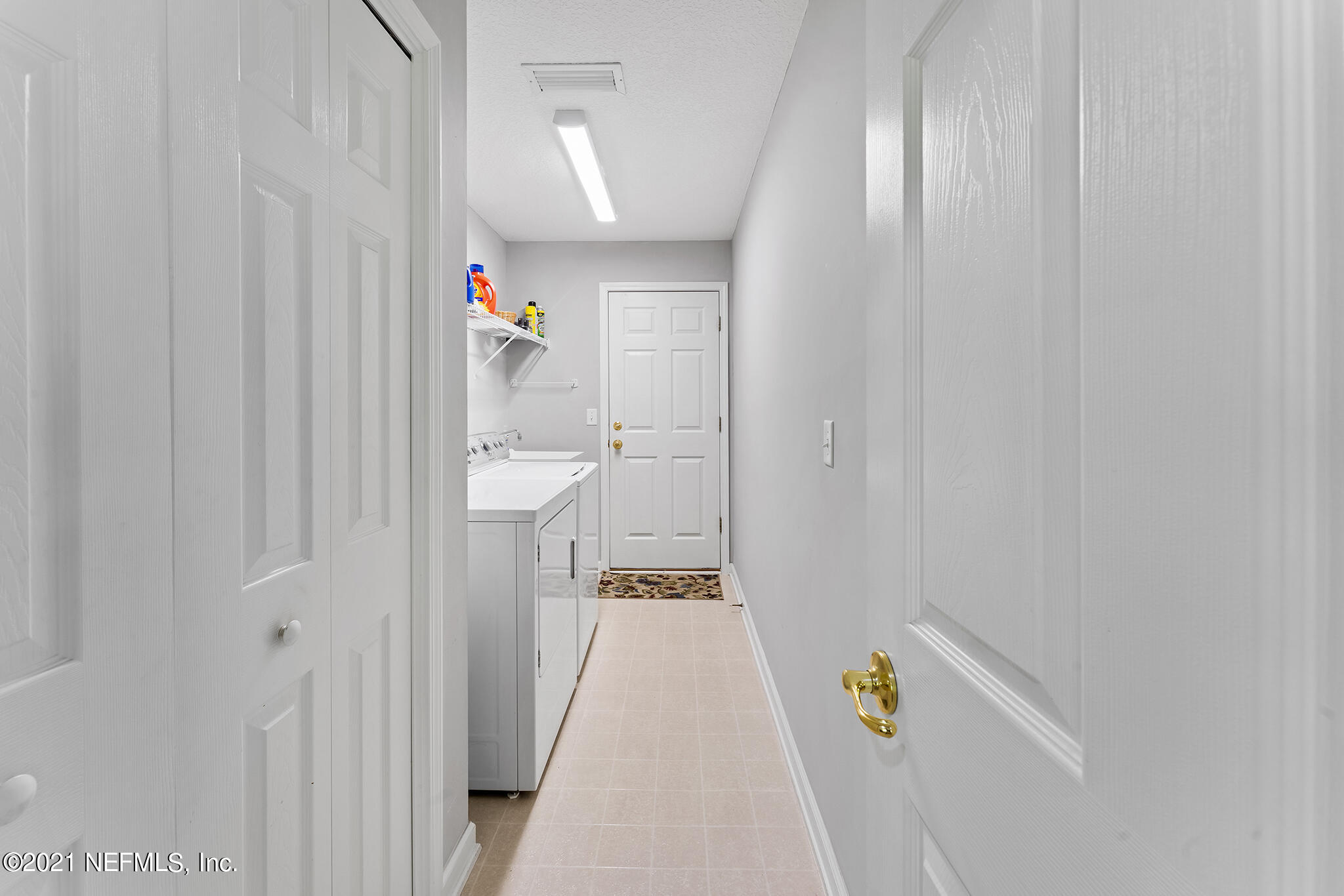 2284 Emilys Way Fleming Island, FL 32003 - Photo 21 of 52 a walk in closet with wooden floor