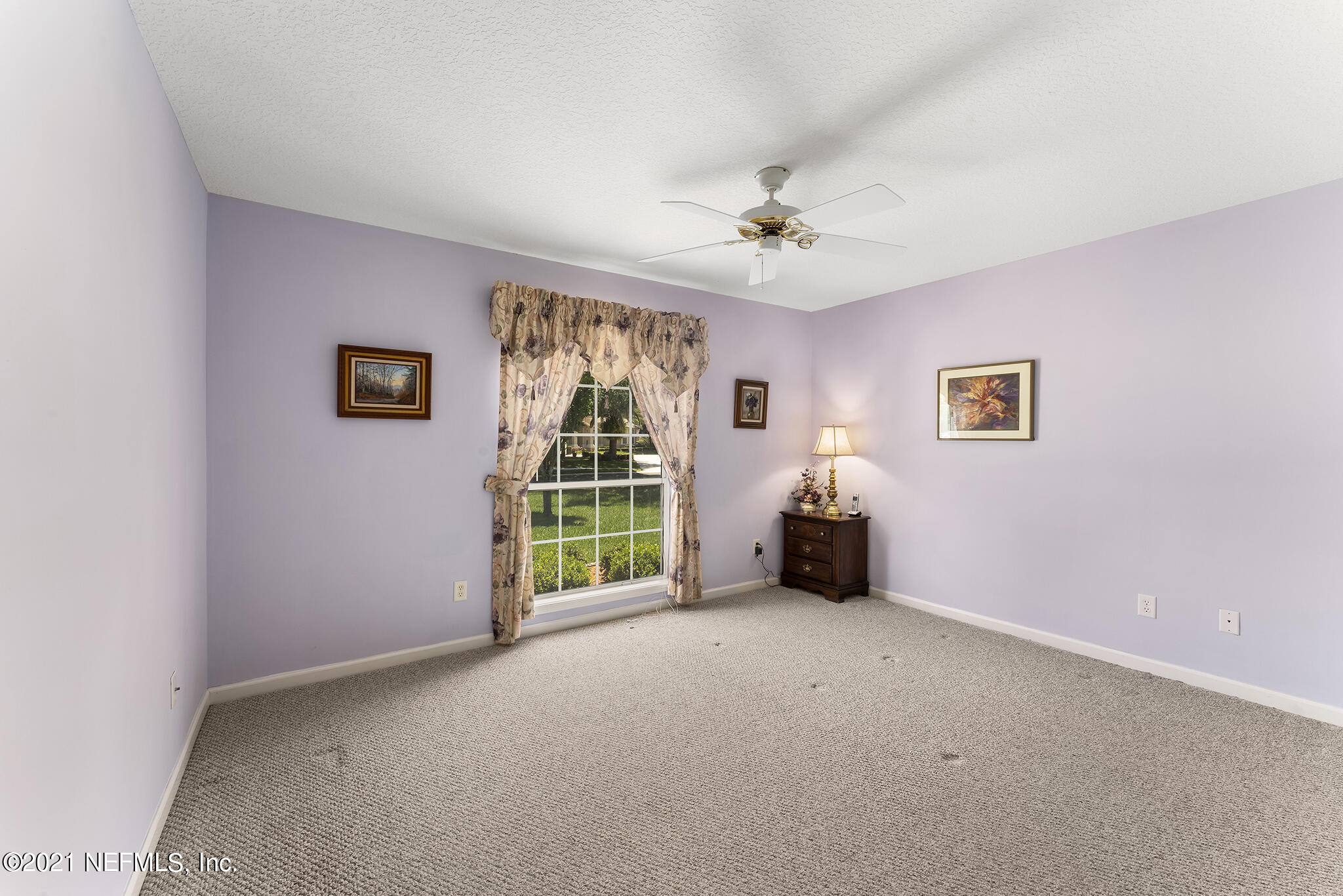 2284 Emilys Way Fleming Island, FL 32003 - Photo 22 of 52 a living room with furniture and a ceiling fan