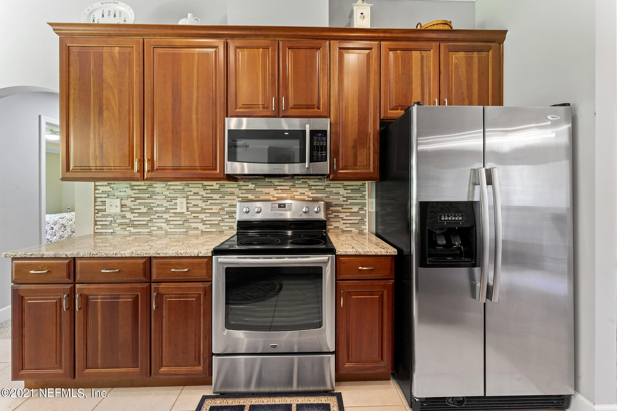 2284 Emilys Way Fleming Island, FL 32003 - Photo 27 of 52 a kitchen with a refrigerator stove and microwave