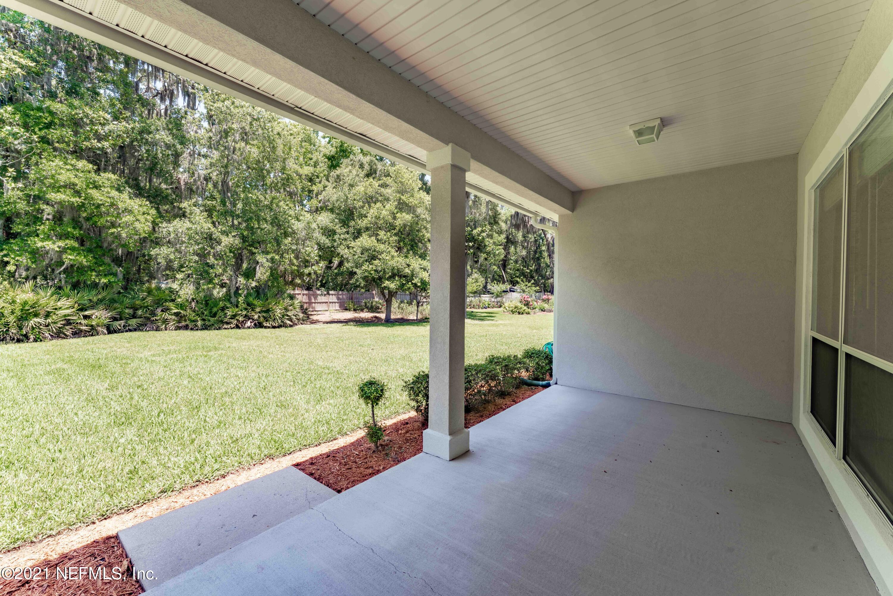 2284 Emilys Way Fleming Island, FL 32003 - Photo 35 of 52 a view of a garden from a window