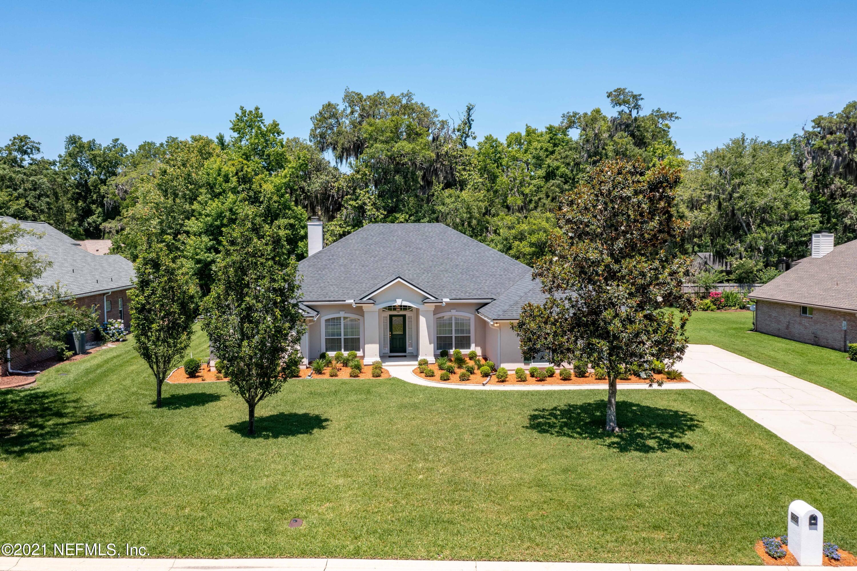 2284 Emilys Way Fleming Island, FL 32003 - Photo 36 of 52 a front view of a house with a yard