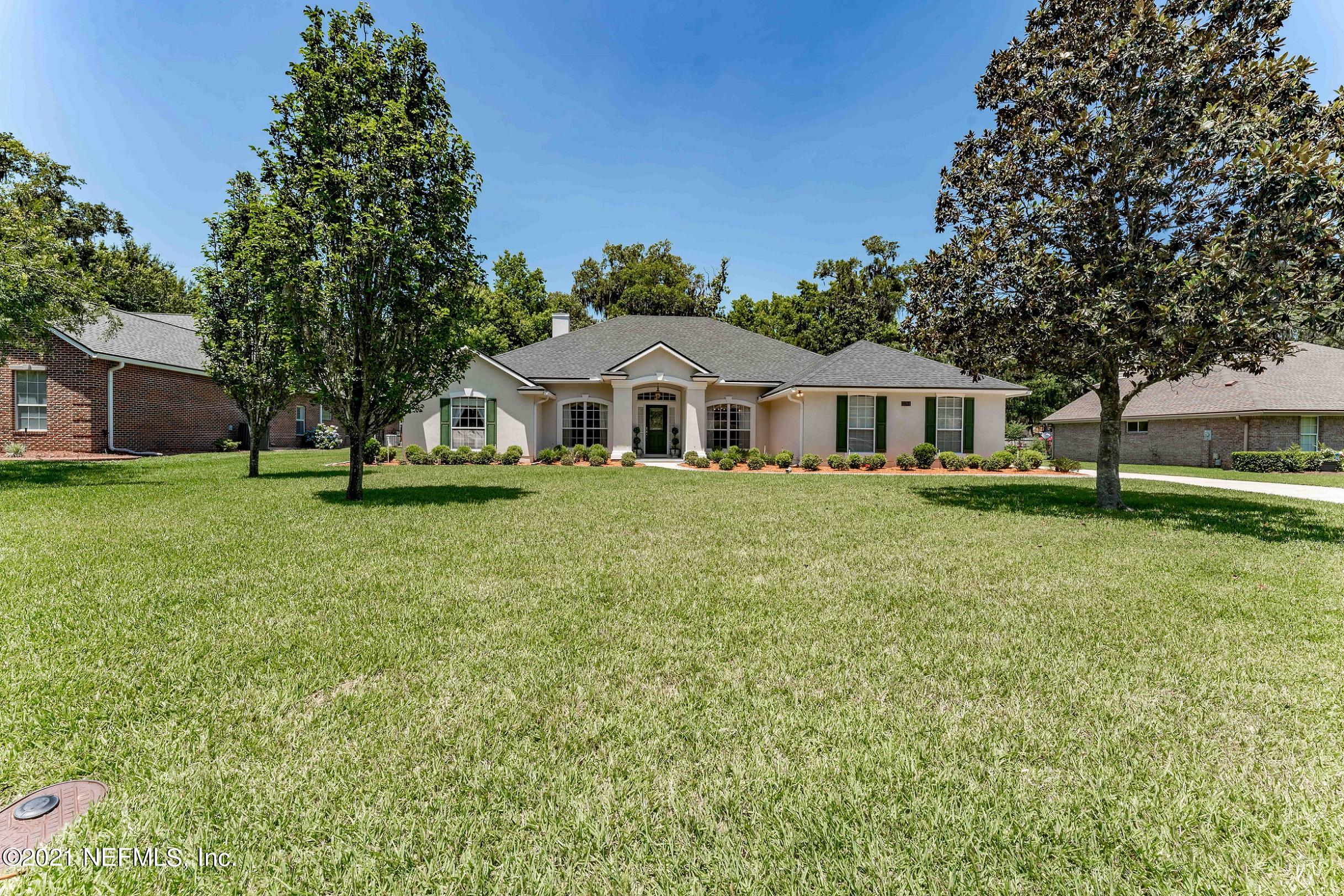 2284 Emilys Way Fleming Island, FL 32003 - Photo 45 of 52 a front view of a house with a yard