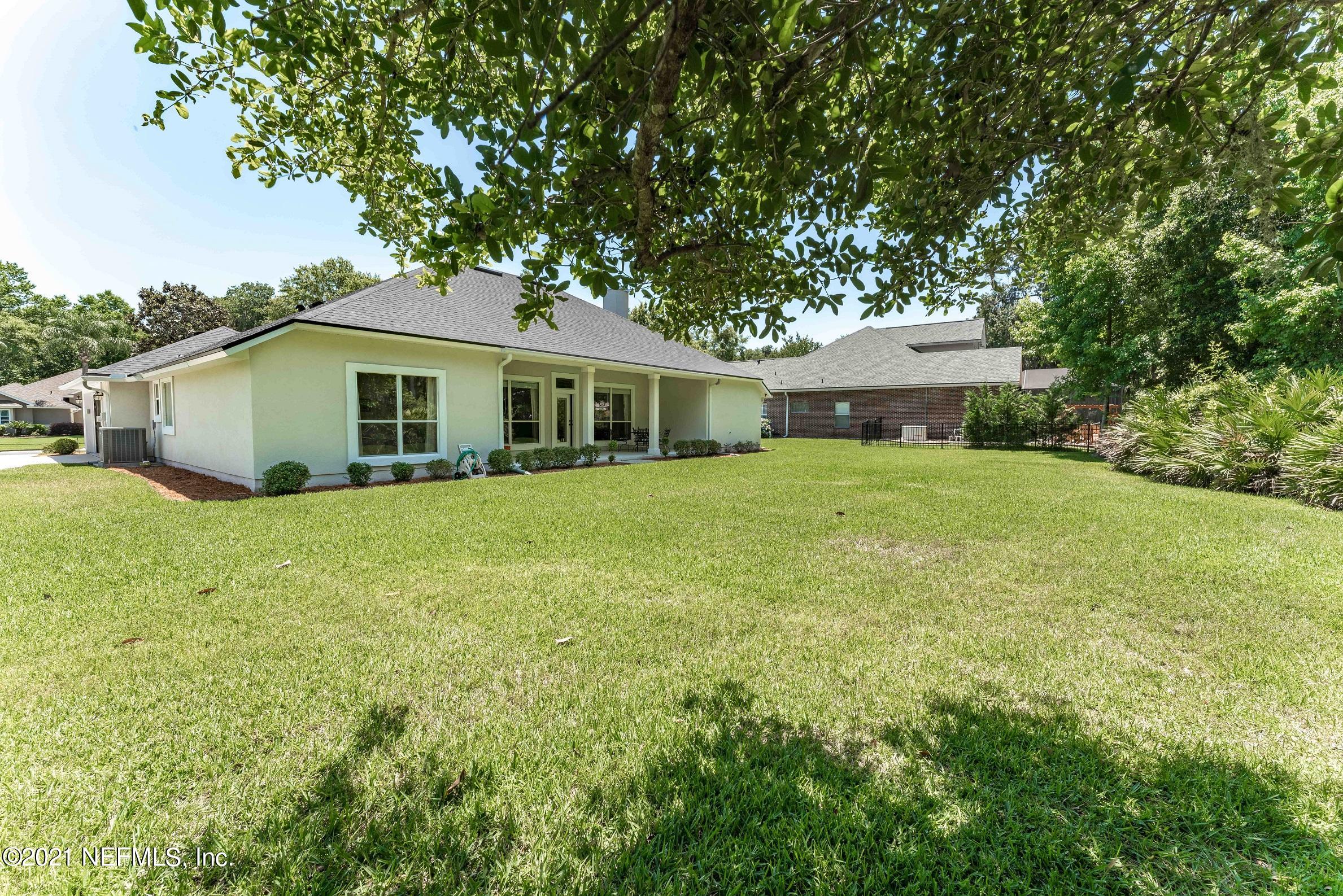 2284 Emilys Way Fleming Island, FL 32003 - Photo 46 of 52 a view of a house with a backyard