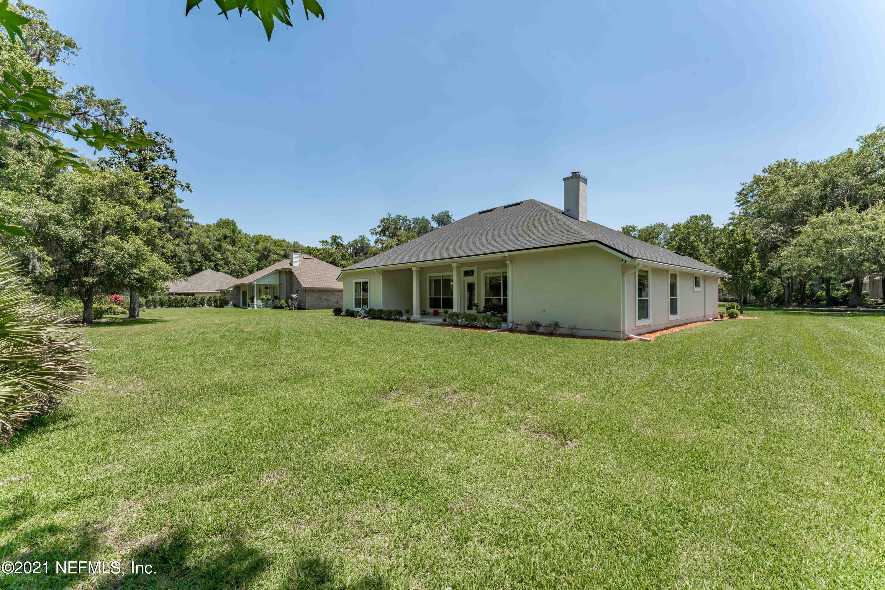 2284 Emilys Way Fleming Island, FL 32003 - Photo 48 of 52 a front view of house with a garden
