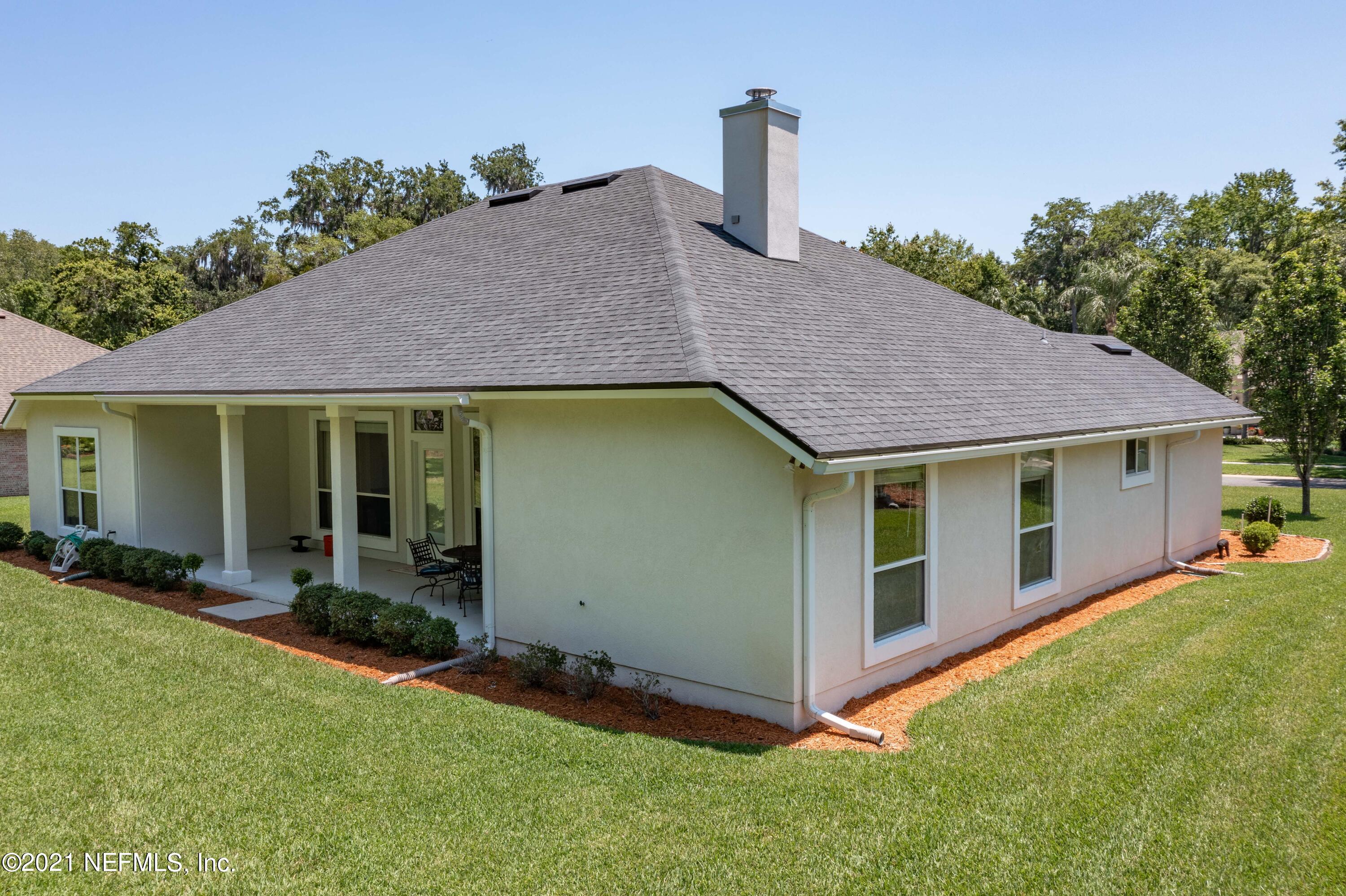 2284 Emilys Way Fleming Island, FL 32003 - Photo 51 of 52 a house view with a garden space
